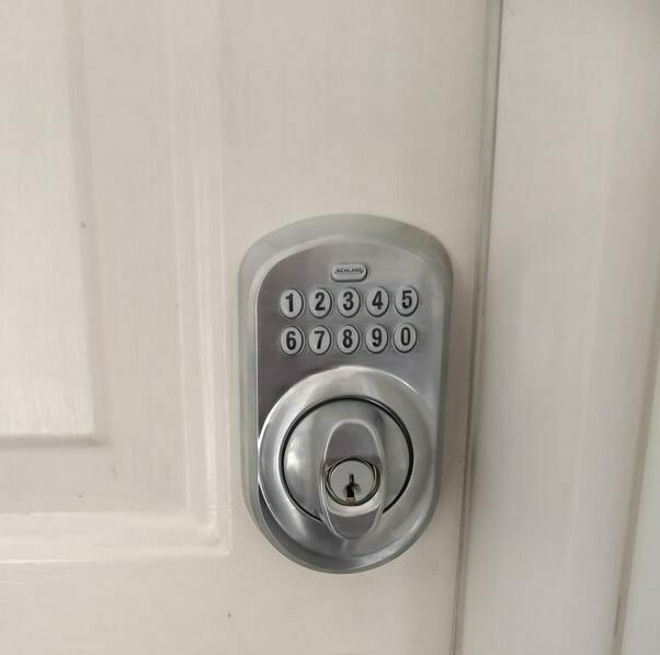 Keyless entry deadbolt installed on a residential door